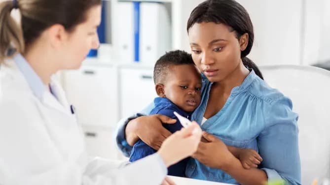 woman at hospital with sick baby